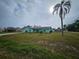 Mint green house with driveway at 1041 Porpoise Rd, Venice, FL 34293