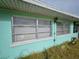 House exterior with aluminum-framed windows at 1041 Porpoise Rd, Venice, FL 34293