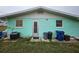 Rear view of the house, showcasing its light green exterior at 1041 Porpoise Rd, Venice, FL 34293