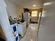 Functional laundry room with washer, dryer, and ample storage at 1041 Porpoise Rd, Venice, FL 34293