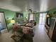 Cozy living room featuring neutral-toned furniture and a large tiger painting at 1041 Porpoise Rd, Venice, FL 34293