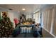 Living room with blue couch, large aquarium, and Christmas tree at 1041 Porpoise Rd, Venice, FL 34293