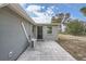 Private patio with tile flooring and exterior AC unit at 11615 Meadow Dr, Port Richey, FL 34668