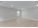 Spacious bedroom with wood-look floors and neutral walls at 1649 N San Mateo Dr, North Port, FL 34288