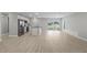 Open kitchen with stainless steel appliances and granite countertops at 1649 N San Mateo Dr, North Port, FL 34288