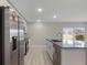 Modern kitchen with stainless steel appliances and granite countertops at 1649 N San Mateo Dr, North Port, FL 34288
