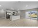 Modern kitchen features granite island and stainless steel appliances at 1649 N San Mateo Dr, North Port, FL 34288