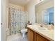 Well-maintained bathroom with shower and wood vanity at 9506 Amberdale Ct # 201, Riverview, FL 33578