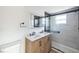 Clean bathroom, featuring double sinks and a walk-in shower at 1490 Fundy Rd, Venice, FL 34293