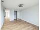 Simple bedroom with mirrored closet and wood-look flooring at 1490 Fundy Rd, Venice, FL 34293