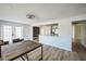 Light and bright dining area with wood floors and access to kitchen at 1490 Fundy Rd, Venice, FL 34293