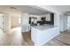 Modern kitchen with white cabinets, quartz countertops, and stainless steel appliances at 1490 Fundy Rd, Venice, FL 34293
