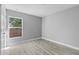 Neutral bedroom with a window providing natural light and light gray walls at 4495 Eldron Ave, North Port, FL 34286