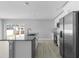 Bright kitchen with a granite countertop island, stainless steel appliances, and backyard view at 4495 Eldron Ave, North Port, FL 34286