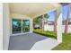 Covered patio with sliding glass doors offering an indoor-outdoor living experience at 4495 Eldron Ave, North Port, FL 34286