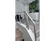 Upstairs hallway with modern metal railing and gray flooring at 5519 Turtle Crossing Loop, Tampa, FL 33625