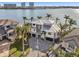 Luxury waterfront home with a large driveway and patio at 7801 9Th S Ave, St Petersburg, FL 33707