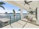 Waterfront balcony with seating and stunning water views at 7801 9Th S Ave, St Petersburg, FL 33707