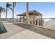 Two boat lifts with covered structures and waterfront access at 7801 9Th S Ave, St Petersburg, FL 33707