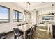 Dining room with large wooden table, black chairs and waterfront views at 7801 9Th S Ave, St Petersburg, FL 33707