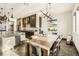Modern dining room adjacent to kitchen with large farmhouse table at 7801 9Th S Ave, St Petersburg, FL 33707