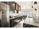 Modern kitchen with stainless steel appliances and a large island at 7801 9Th S Ave, St Petersburg, FL 33707