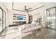 Spacious living room with herringbone floors, large TV, and wine cellar at 7801 9Th S Ave, St Petersburg, FL 33707