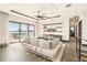 Living room with herringbone floors, large windows, and waterfront view at 7801 9Th S Ave, St Petersburg, FL 33707