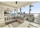 Large covered patio with sectional sofa and water views at 7801 9Th S Ave, St Petersburg, FL 33707