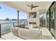 Covered patio with comfortable seating and fireplace at 7801 9Th S Ave, St Petersburg, FL 33707