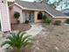 House exterior with walkway and landscaping at 12010 Villa Rd, Spring Hill, FL 34609
