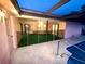 View of the pool area with an enclosed patio at 12010 Villa Rd, Spring Hill, FL 34609