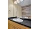 Bathroom with wood-look wall, vanity, and updated sink at 304 Tavernier Dr, Oldsmar, FL 34677