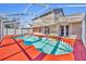 Large kidney-shaped pool with screened enclosure at 304 Tavernier Dr, Oldsmar, FL 34677