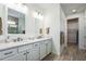 Double vanity bathroom with plenty of counter space and a walk-in closet at 7766 Summerland Cv, Lakewood Ranch, FL 34202
