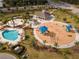 Community pool, playground, and clubhouse are featured in this aerial view at 33161 Kateland Dr, Wesley Chapel, FL 33545