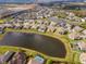 Aerial perspective of lakefront properties in a desirable community at 33161 Kateland Dr, Wesley Chapel, FL 33545