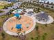 Community pool, playground, and clubhouse are featured in this aerial view at 33161 Kateland Dr, Wesley Chapel, FL 33545