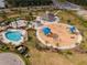 Community pool, playground, and clubhouse are featured in this aerial view at 33161 Kateland Dr, Wesley Chapel, FL 33545