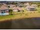 Aerial view of property, showcasing lakefront location at 33161 Kateland Dr, Wesley Chapel, FL 33545