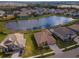 Luxury homes surrounding a lake in a community at 33161 Kateland Dr, Wesley Chapel, FL 33545