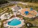 Community pool, playground, and clubhouse are featured in this aerial view at 33161 Kateland Dr, Wesley Chapel, FL 33545