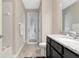 Bathroom with shower, toilet and exterior access at 33161 Kateland Dr, Wesley Chapel, FL 33545