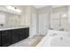 Bathroom with double vanity, garden tub and walk in shower at 33161 Kateland Dr, Wesley Chapel, FL 33545
