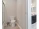 Small bathroom with toilet and shower at 33161 Kateland Dr, Wesley Chapel, FL 33545