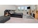Spacious bedroom with large bed, TV, and ample natural light at 33161 Kateland Dr, Wesley Chapel, FL 33545