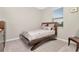 Bedroom with a full-size bed and wood frame at 33161 Kateland Dr, Wesley Chapel, FL 33545