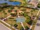 Community park featuring a playground, basketball court, and walking paths at 33161 Kateland Dr, Wesley Chapel, FL 33545