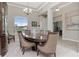 Formal dining room with a large table, chairs, and a china cabinet at 33161 Kateland Dr, Wesley Chapel, FL 33545