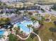 Community pool and clubhouse with palm trees at 33161 Kateland Dr, Wesley Chapel, FL 33545